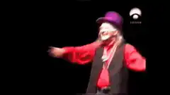 Elvis impersonator pointing