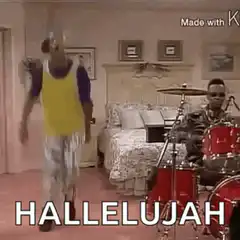 Man dancing in bedroom while another plays drums