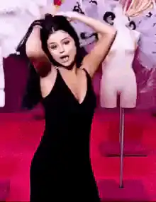 Kylie Jenner posing in a black dress