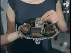 Woman eating chocolate with a pearl