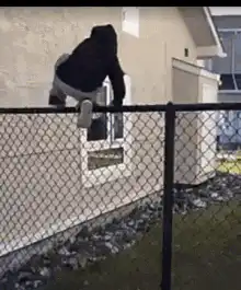 person falls off fence