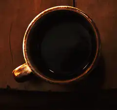 Top view of a steaming coffee cup