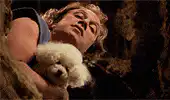 woman holding a white poodle