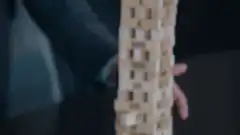 Jenga tower collapses after block removed