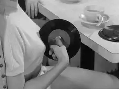 woman holding vinyl record