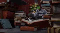 Mort reading a book surrounded by stacks