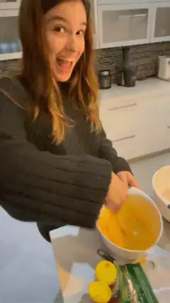 Woman excitedly whisking eggs