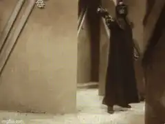 Darth Vader shoots a man with a lightning bolt