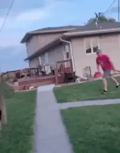 Man jumps over horse in backyard