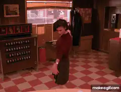 Woman dancing in a diner