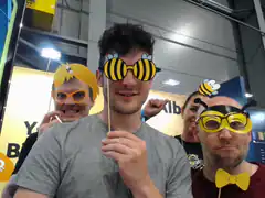 people holding bee props