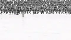 person running from marching army