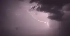Lightning bolt in dark storm clouds