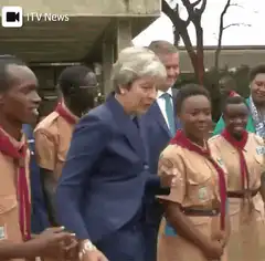 Theresa May dances with scouts