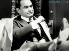 Man in suit adjusting his jacket