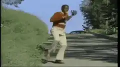 Man dancing on sidewalk