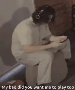 Guy playing guitar with headphones