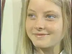 Jodie Foster smiling and looking away