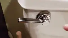 Finger gets stuck in toilet flush handle