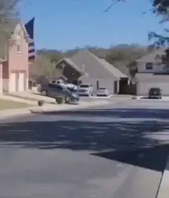 Monster truck drives past giant American flag