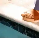 Toilet paper roll dipping in pool