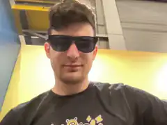 Man in sunglasses with yellow background