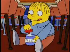 Ralph Wiggum dipping finger in paste