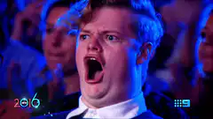 Man screaming in shock at event