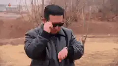 Kim Jong Un takes off sunglasses and checks watch