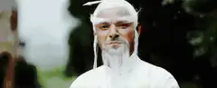 Old man strokes his white beard