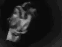 Woman holding a baby in black and white