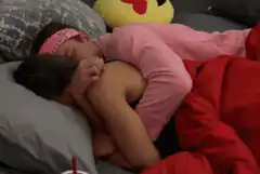 Couple cuddling in bed