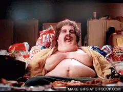 Fat man surrounded by junk food