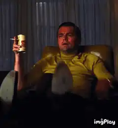 Leonardo DiCaprio pointing and drinking