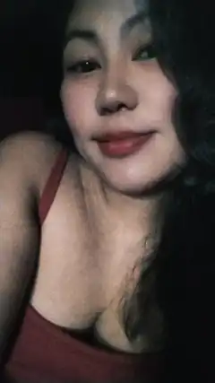 woman in red top smiling