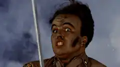 Officer Dick swings a sword