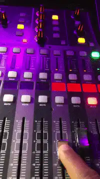 Finger adjusting audio mixer faders