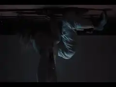 person hanging upside down from ceiling