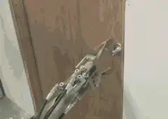 Robot breaks through wooden door