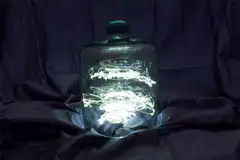 Glowing light painting in glass jar