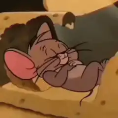 Jerry eating cheese in bed