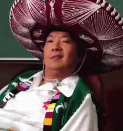 Ken Jeong in sombrero pointing