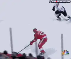 Hockey player gets tangled in goal post