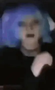 blurry blue hair person screaming