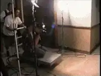 cameraman filming woman on set