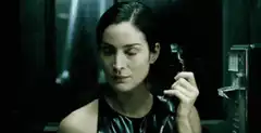 Trinity holds phone receiver
