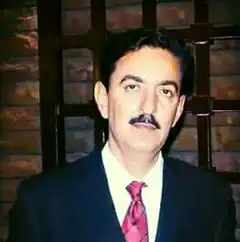 Man in suit with mustache