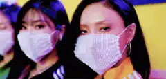 K-pop idols in sparkly masks