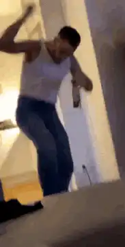 man dancing with beer bottle