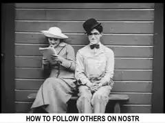Two people sitting on a bench